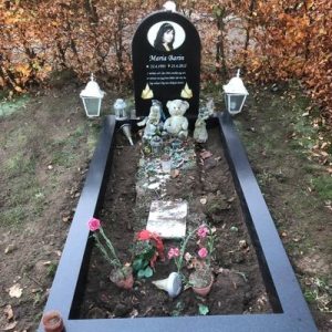 Installed Peaceyard® customer headstone, model Eliza. Material color Deep Night Sky with feathered edge image print and options standard base with wide full frame Picture of Installed customer headstone, Deep Night Sky Peaceyard® Eliza