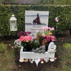 Installed Peaceyard® customer headstone, model Ada. Material color Glacier White with bleed print image and options standard base with square planter Picture of Installed customer headstone, Glacier White Peaceyard® Ada