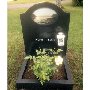 picture of installed peaceyard upright gravestone, model cora in night sky material with customer graphics