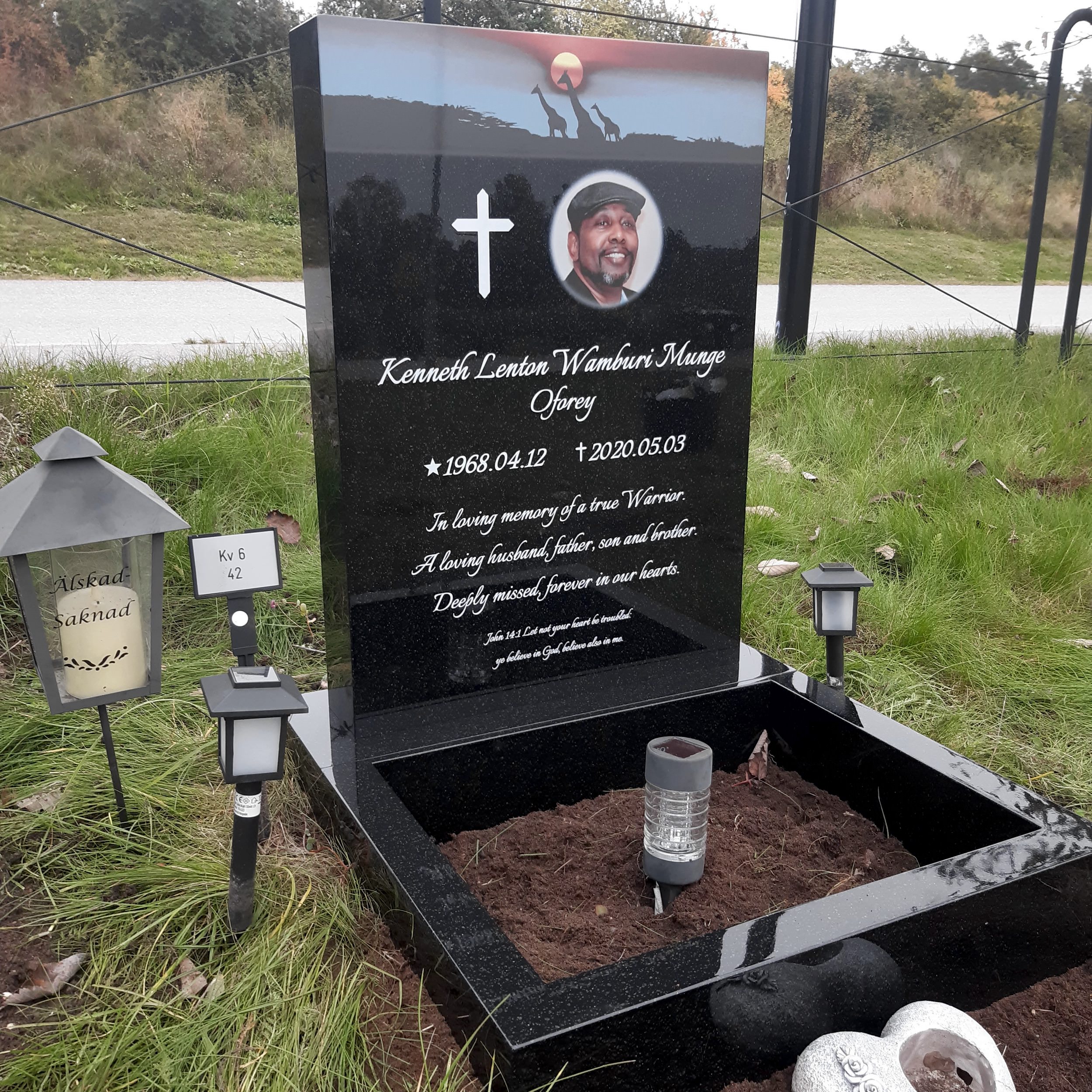 picture of installed peaceyard upright gravestone, Ada in Night Sky material with customer graphics