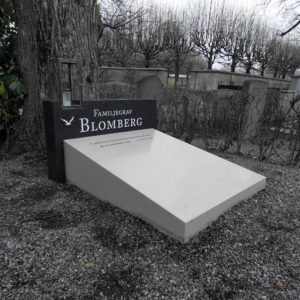 picture of installed peaceyard horizontal/hybrid gravestone, custom model in night sky and aurora material with customer graphics and custom modern stainless steel lantern